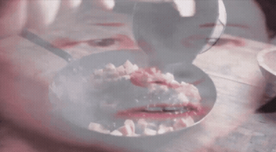 Woman Reflected In Frying Pan GIF