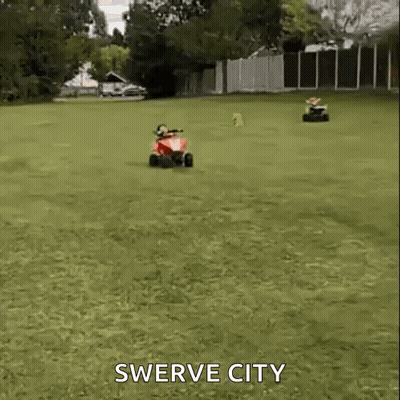 Woman Riding Red ATV Swerve City GIF