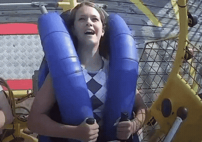 Woman Riding Roller Coaster In Blue Life Preserver GIF