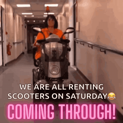 Woman Riding Scooter In Hallway GIF