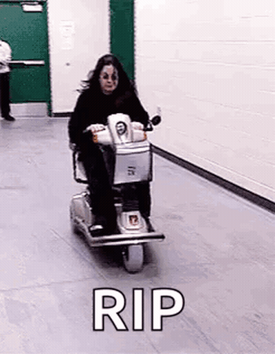 Woman Riding Scooter With Rip GIF