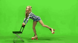 Woman Roller Skating With Chair GIF