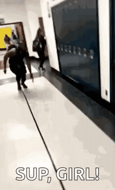 Woman Running Down School Hallway Saying Sup Girl GIF