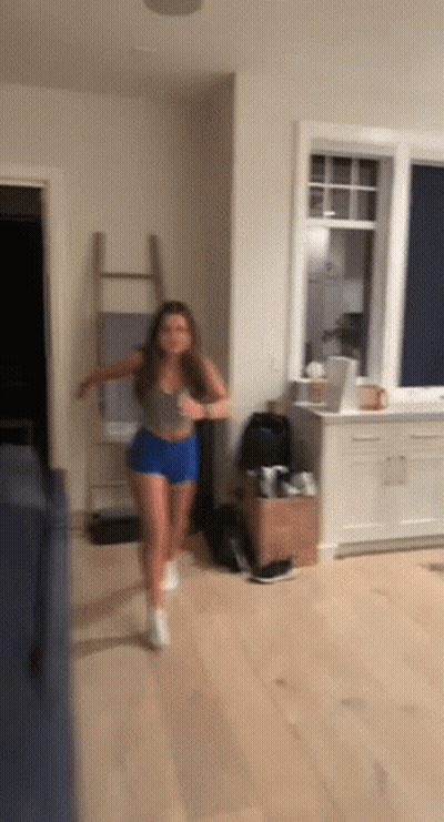 Woman Running In Living Room In Front Of Window GIF