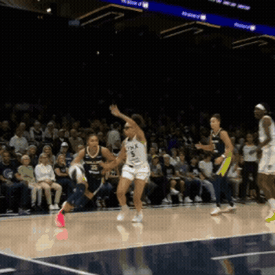 Woman Running On Basketball Court With Minnesota GIF