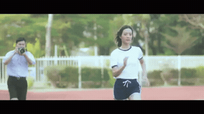 Woman Running On Track Man Taking Picture GIF