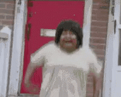 Woman Running Out Of Red Door GIF