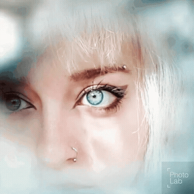 Woman's Blue Eye With Nose Ring And Piercing GIF