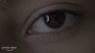 Woman's Eye With Arrow Pointing To Prime Video Logo GIF