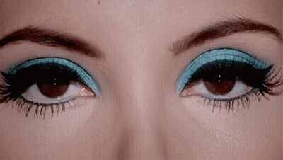 Woman's Eyes With Blue And Black Eye Shadow GIF