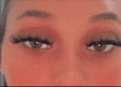 Woman's Eyes With Long Eyelashes And Red Cheeks GIF