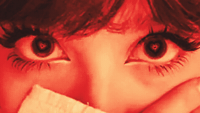 Woman's Eyes With Paper Over Mouth GIF