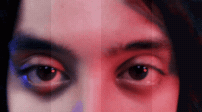 Woman's Eyes With Red And Blue Lights GIF