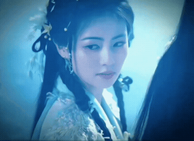 Woman's Face Close Up Blue Background GIF