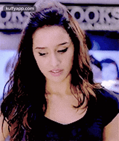 Woman's Face Close-Up In Black Shirt GIF