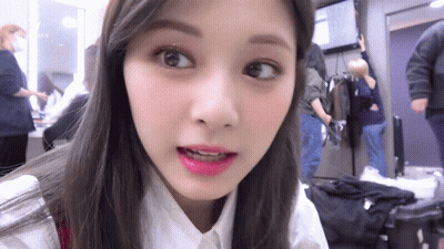 Woman's Face Close Up Looking At Camera GIF