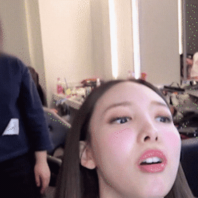 Woman's Face Close Up Man Standing Behind GIF