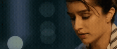 Woman's Face Close Up With Light Behind GIF
