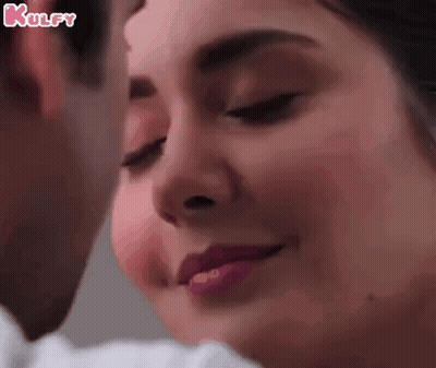 Woman's Face Close Up With Man Behind GIF