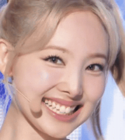 Woman's Face Close Up With Microphone GIF