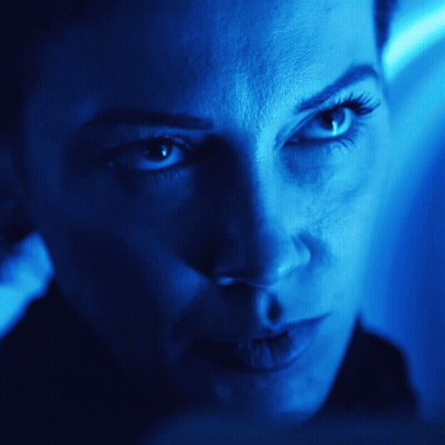 Woman's Face In Blue Light GIF