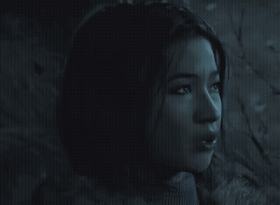 Woman's Face In Dark Room GIF