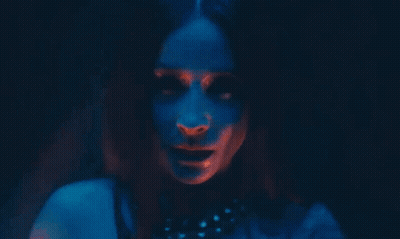 Woman's Face In Dark Room With Red And Blue Lights GIF