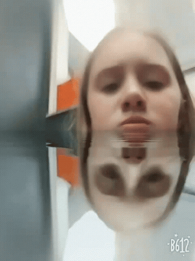 Woman's Face In Mirror With B612 GIF