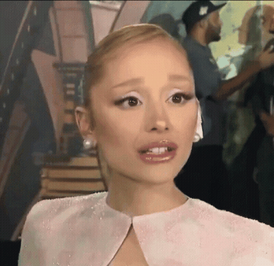 Woman's Face In Pink Dress Close-Up GIF