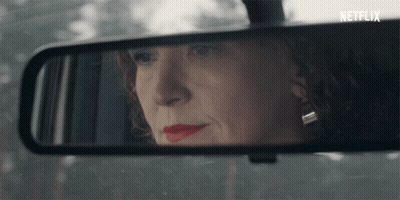 Woman's Face Reflected In Rear View Mirror Netflix GIF