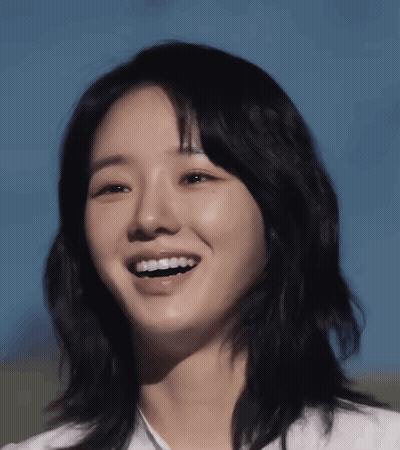Woman's Face With Blue Sky Behind Her GIF