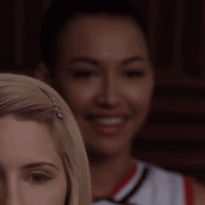 Woman's Face With Cheerleader Behind GIF