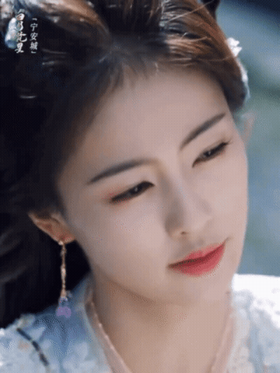 Woman's Face With Chinese Writing GIF
