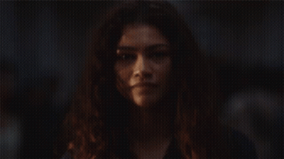 Woman's Face With Crowd Background GIF