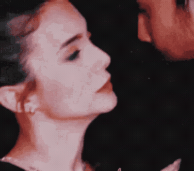 Woman's Face With Man Applying Makeup GIF
