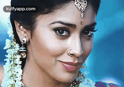 Woman's Face With Nose Ring And Earrings GIF
