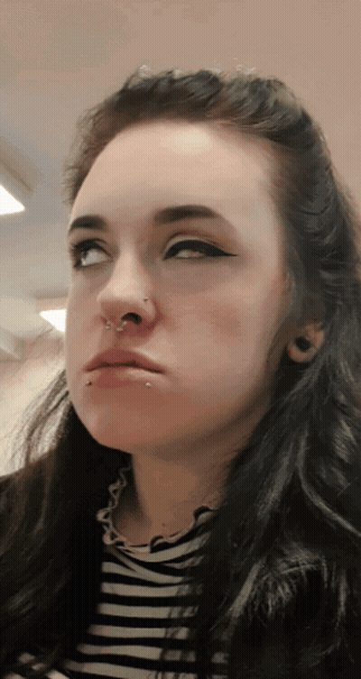 Woman's Face With Nose Ring And Piercings GIF