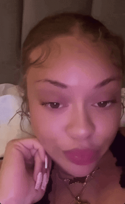 Woman's Face With Pink Background GIF