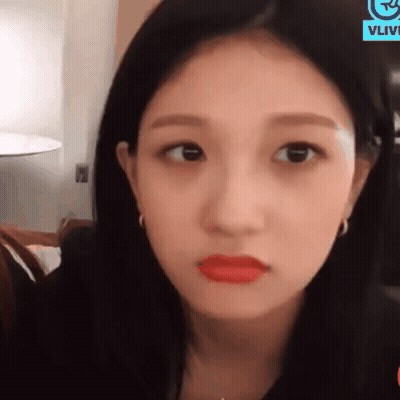 Woman's Face With Red Lips And Earrings GIF