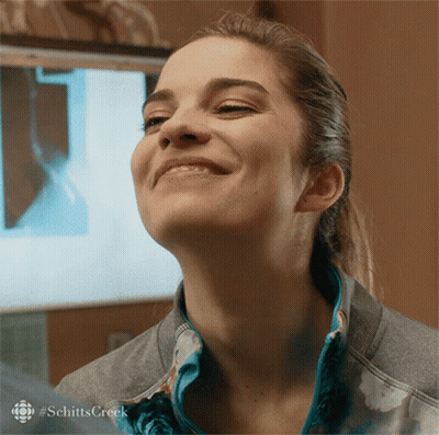 Woman's Face With Schitts Creek Text GIF