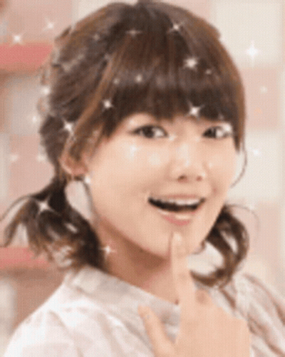 Woman's Face With Sparkles In Hair GIF