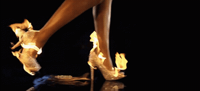 Woman's Feet On Fire In High Heels GIF