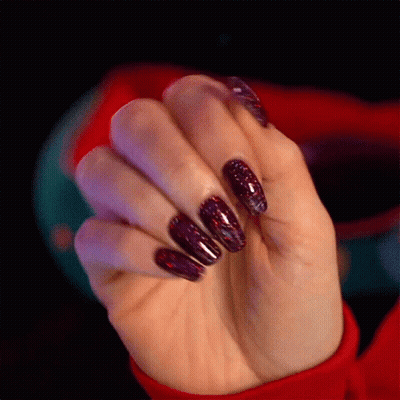 Woman's Hand In Red Sweater GIF