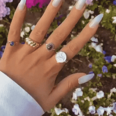 Woman's Hand With Many Rings GIF