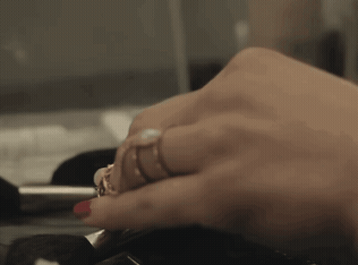 Woman's Hand With Multiple Rings GIF