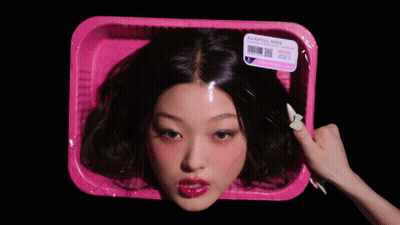 Woman's Head In Pink Container GIF