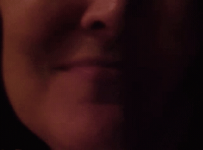 Woman's Lips In The Dark GIF