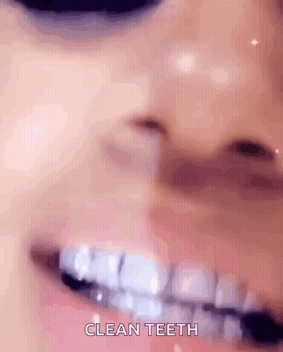 Woman's Mouth With Braces Saying Clean Teeth GIF