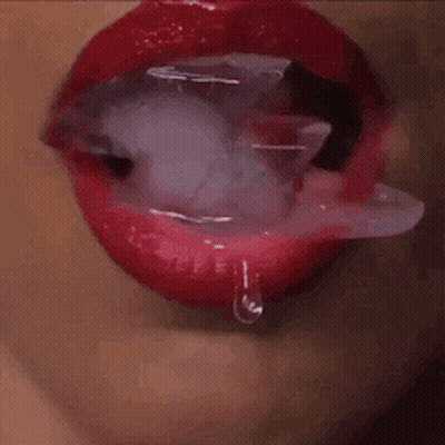 Woman's Mouth With Ice Cubes And Droplet GIF