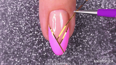 Woman's Nails Painted Pink And Gold GIF